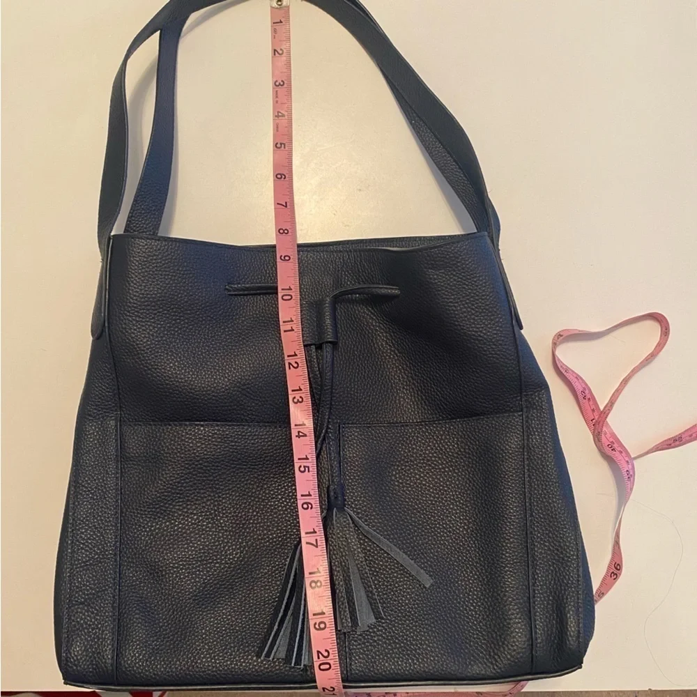 LAGGO || Andrea Tassel Drawstring Hobo Bag Pockets Pebbled Leather Navy‎